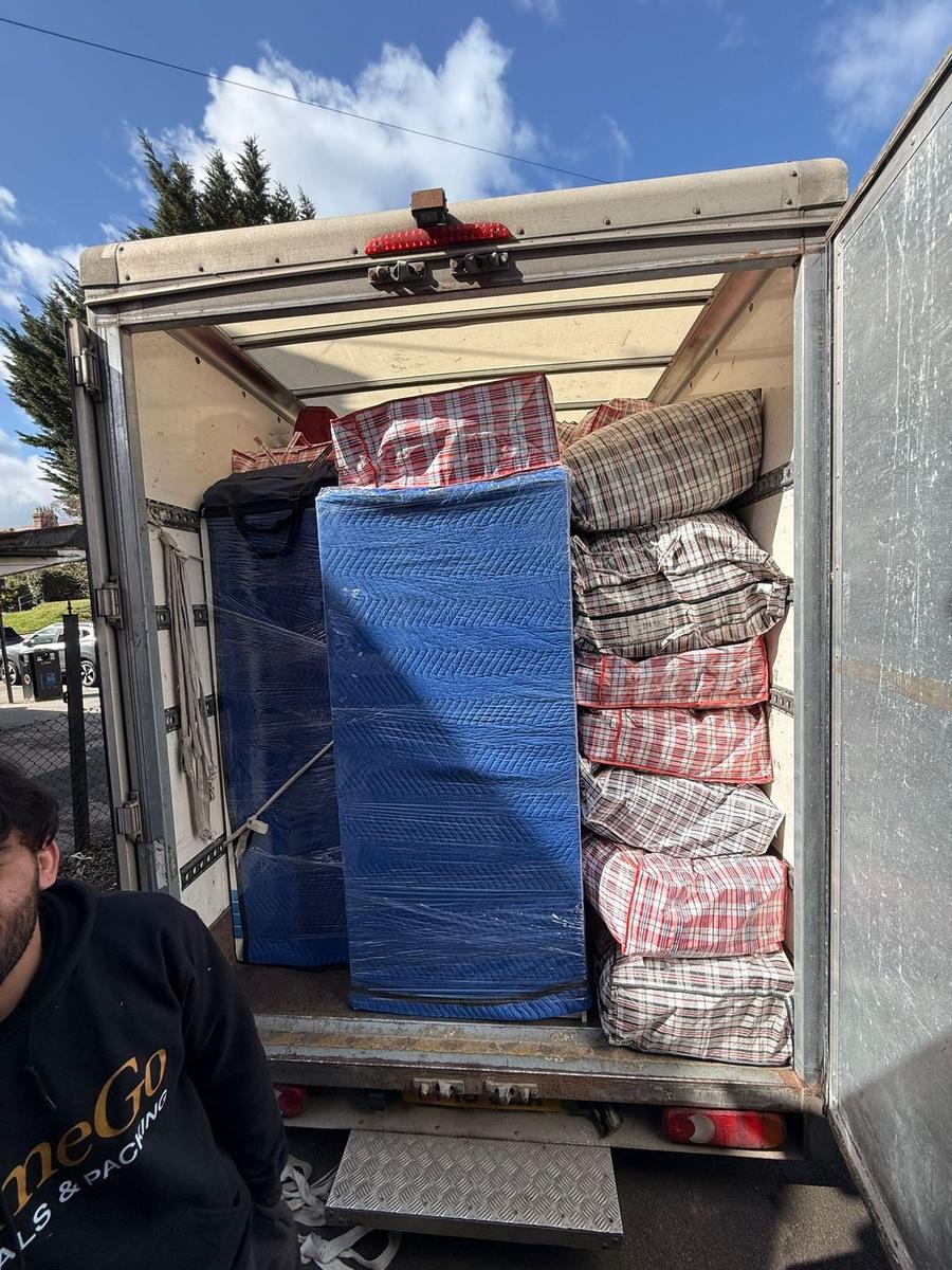 HomeGo crew loading a branded removals van for a house move