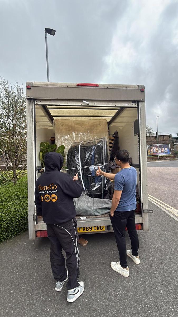 HomeGo crew loading a wardrobe for a short across-town move