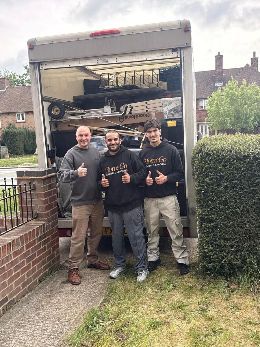 Three HomeGo movers in branded uniform after a quick same-day local move