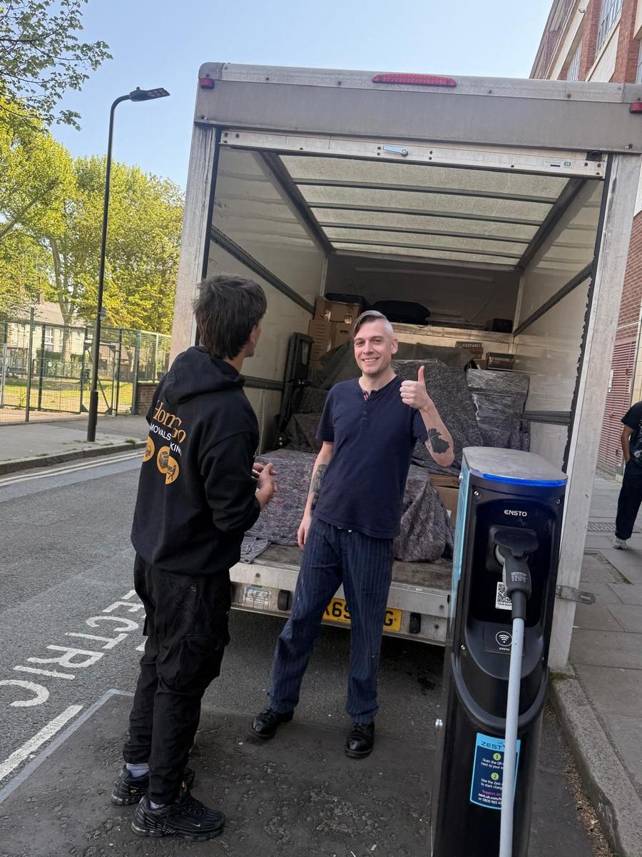 Happy HomeGo customer alongside the mover after a short-distance same-day removal