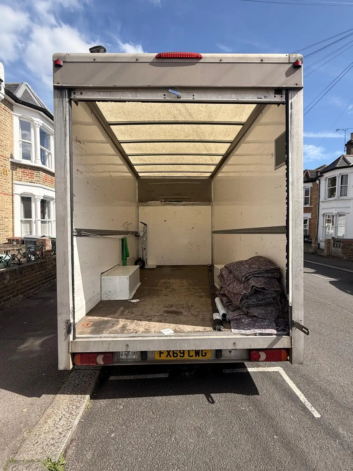 HomeGo Removals branded Mercedes Luton van — comparing man and van vs full removals services in the UK